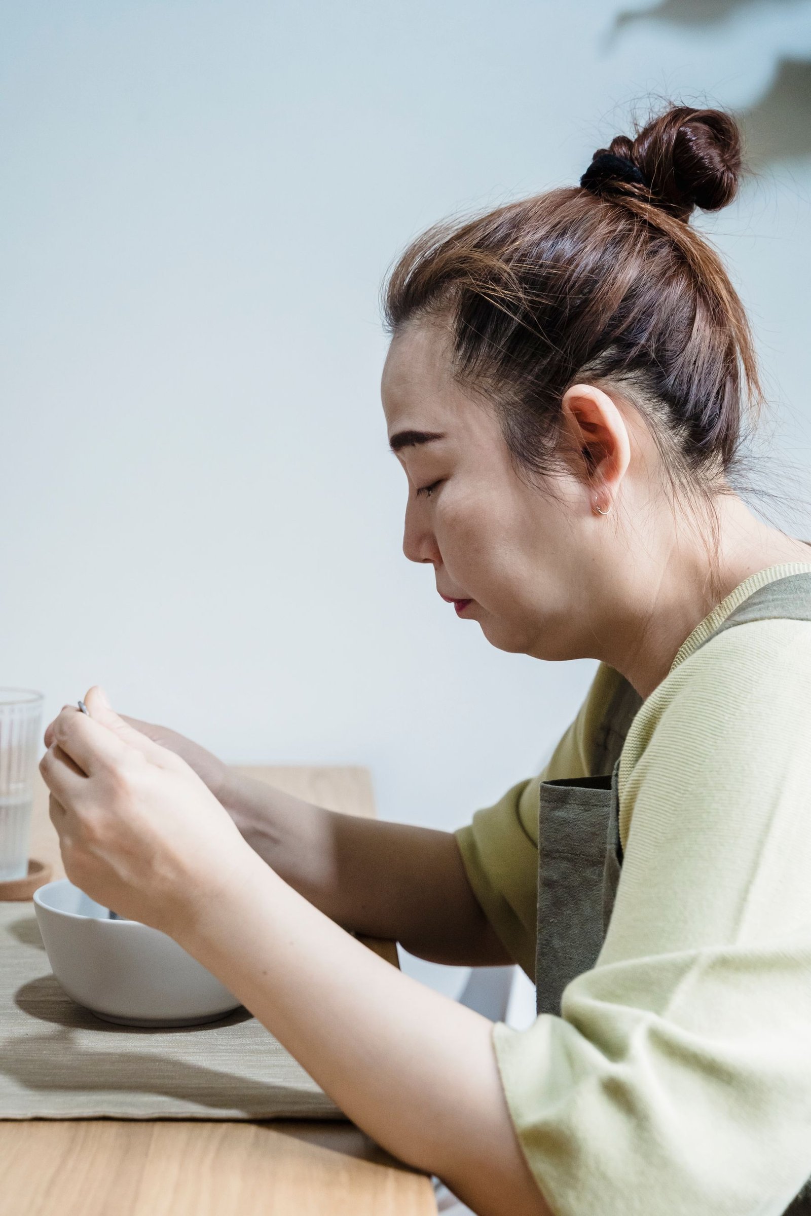 A woman eating breakfast at home