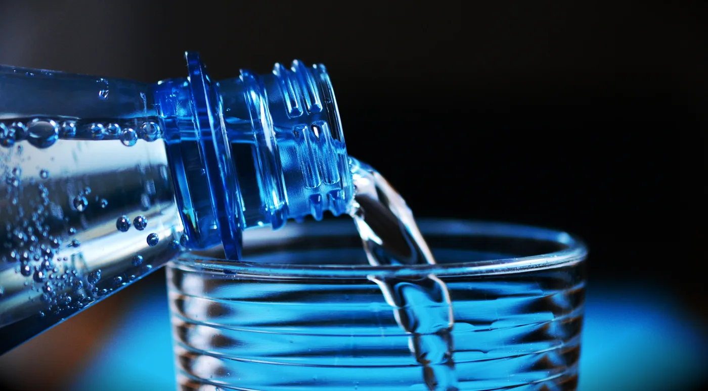 Bubbles rising in a glass of sparkling water