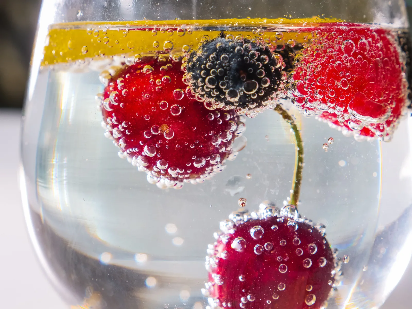 Berries and lemon in a sparkling drink