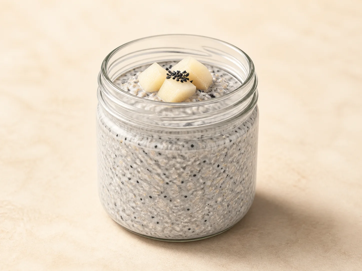A finished serving of black sesame pear kefir overnight oats